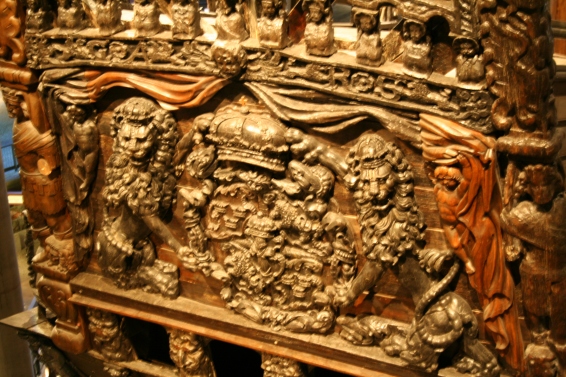 The boat was carved elaborately and painted beautifully. Color and paint experts have examined the wreckage to determine the probable colors used for this section, as seen in the drawing above.